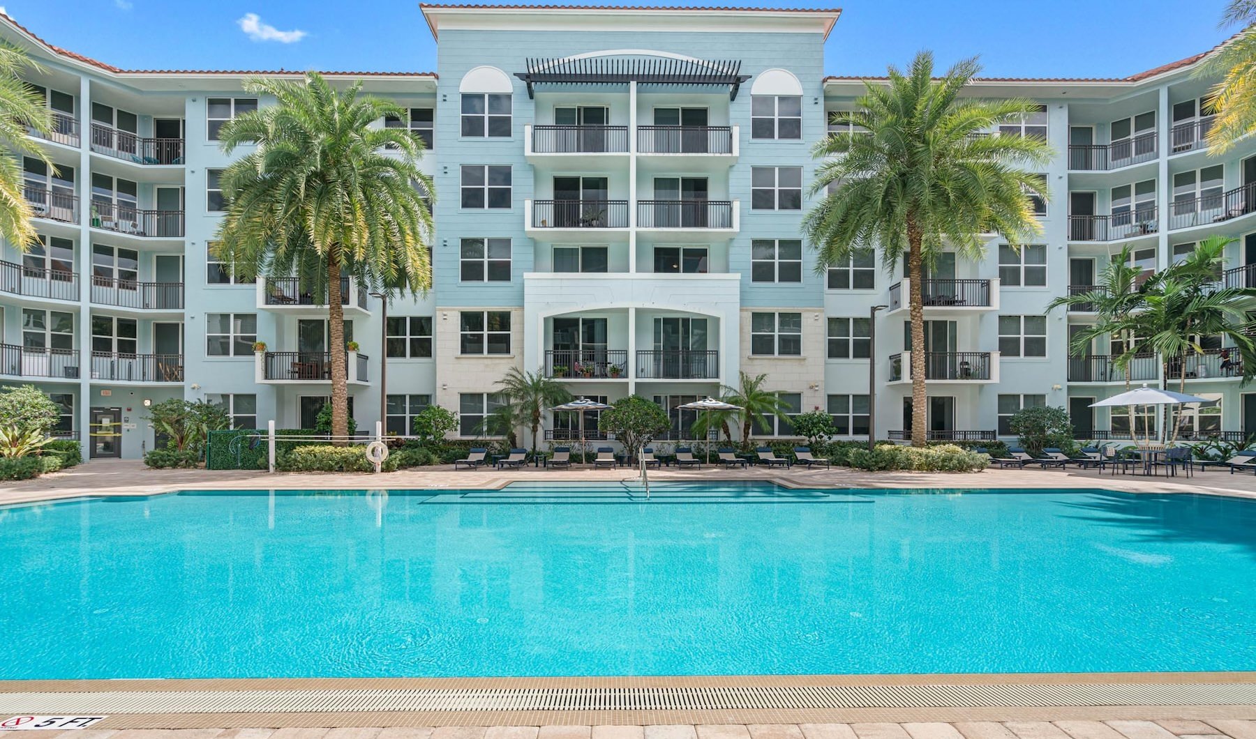 swimming pool with a building in the background