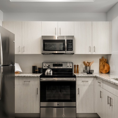 Miami apartment near FIU featuring a modern kitchen with white cabinets