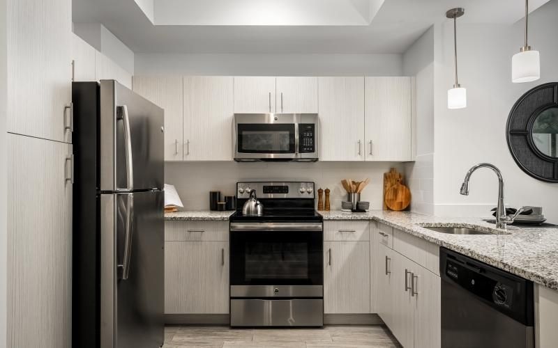 a kitchen with white cabinets