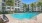 Community pool with chairs and trees
