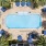 An overhead view showing the resort-style pool and cabana area at Paraiso at Fountain Square Miami apartments. 