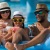 a family in a pool using a floaty