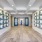 entrance with artwork on the walls and glass doors at Miami apartments, Paraiso at Fountain Square.