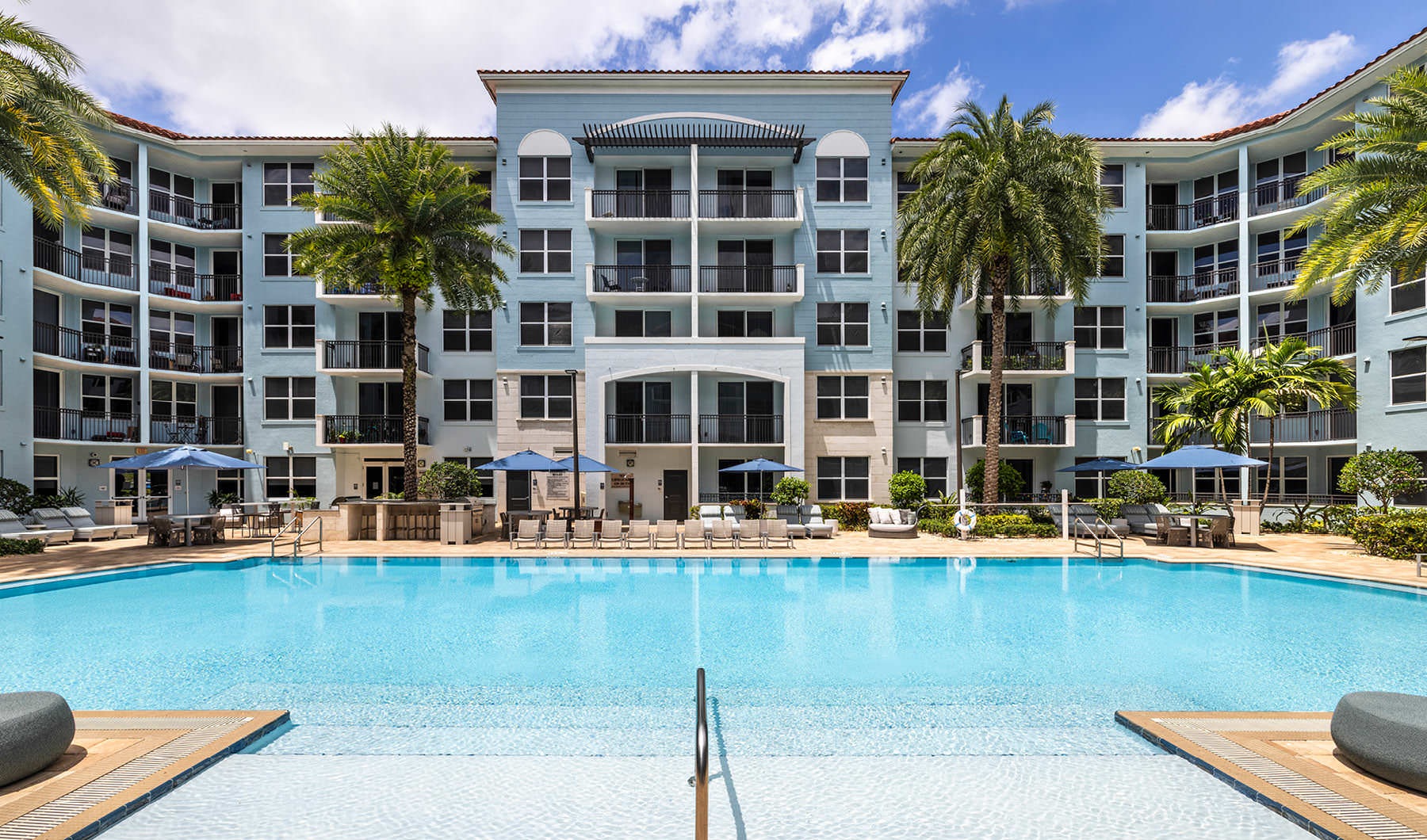swimming pool with a building in the background
